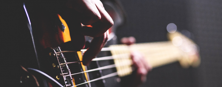 man strumming guitar
